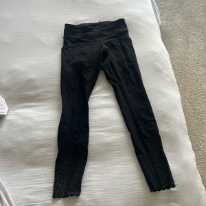 Black Lululemon leggings with reflective bottom